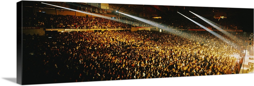 Wide angle photograph on a big canvas of ceiling spotlights beaming onto a stage, past thousands of fans at a rock concert...