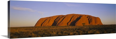 Rock formations on a landscape, Ayers Rock, Uluru-Kata Tjuta National Park, Northern Territory, Australia