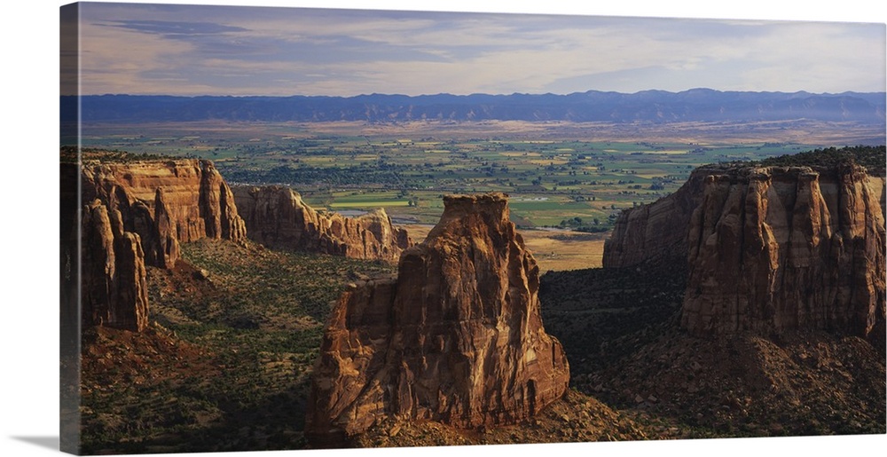 Big, landscape photograph of large rocks of the Colorado National Monument in Grand Junction, Colorado, a scenic, green la...