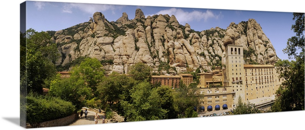 Rock formations over a monastery, Montserrat Monastery, Montserrat Barcelona, Catalonia, Spain
