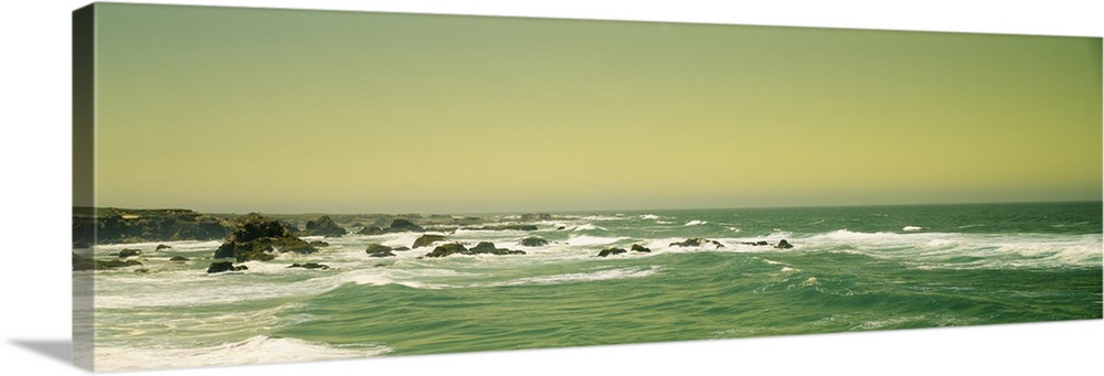Panoramic photograph of rocky shoreline.