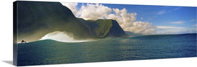Rolling waves with mountains in the background, Molokai, Hawaii