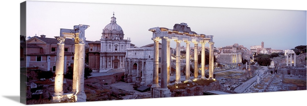 Panoramic photograph of historic ruins with crumbling and eroded stone pillars and buildings.