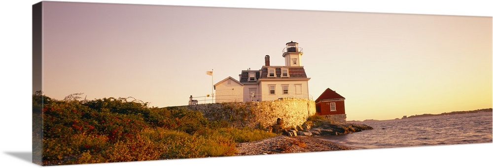 Panoramic photograph on a big canvas of the Rose Island lighthouse overlooking the water at sunset, in Newport, Rhode Island.