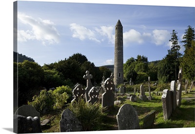 Round Tower and Graveyard in Glendalough Early Monastic Site, County Wicklow, Ireland