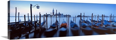 Row of gondolas moored near a jetty, Venice, Italy