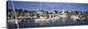 image thumbnail of This is a panoramic photograph of a harbor in New England filled with sail boats and a small village in the background.