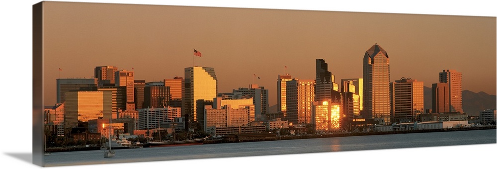 This wall art is a panoramic photograph of the city skyline reflecting the fading sunlight.
