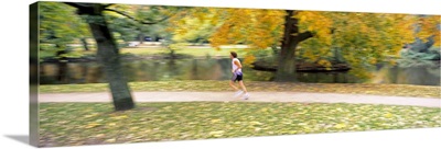 Side profile of a person jogging in a park, Vondelpark, Amsterdam, Netherlands