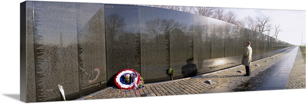 Side profile of a person standing in front of a war memorial, Vietnam Veterans Memorial, Washington DC