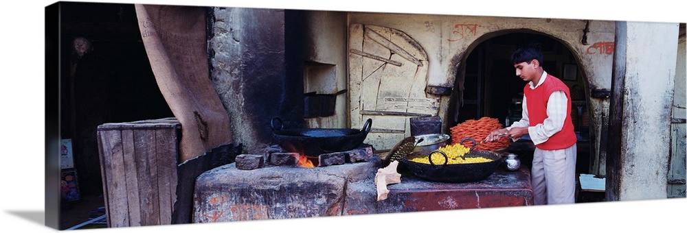 Side profile of a young man preparing sweet food, Mandawa, Rajasthan, India