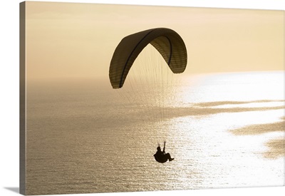 Silhouette of a paraglider flying over an ocean, Pacific Ocean, San Diego, California