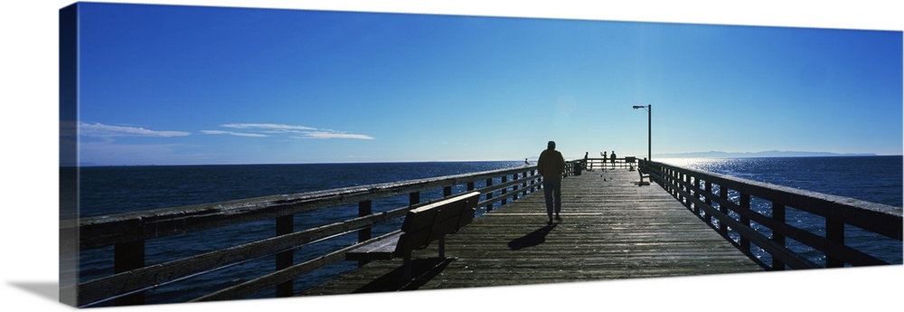 Silhouette of a person walking on a pier, Goleta Beach Pier, Goleta, California, USA