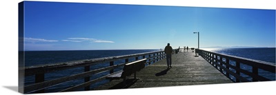 Silhouette of a person walking on a pier, Goleta Beach Pier, Goleta, California