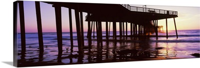 Silhouette of a pier at dusk, Pismo Pier, Pismo Beach, California