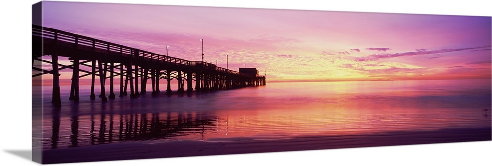 Silhouette of a pier at sunset, Newport Pier, Newport Beach, Balboa Peninsula, California, USA