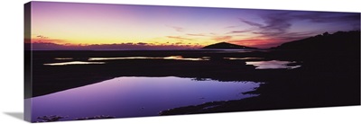 Silhouette of an island at dusk, Burgh Island, Bantham Beach, South Devon, England