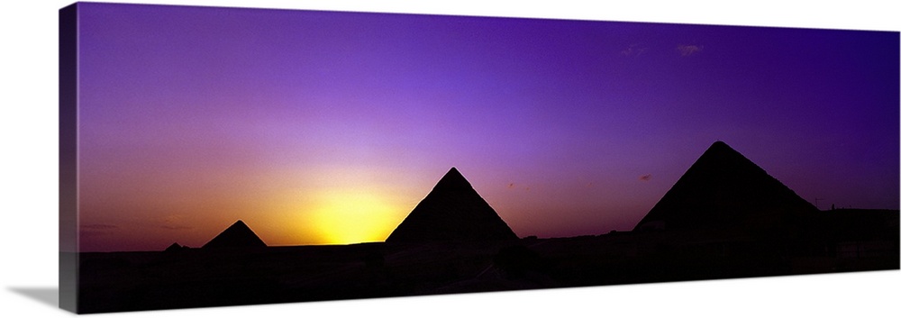 Silhouette of pyramids at dusk, Giza, Egypt