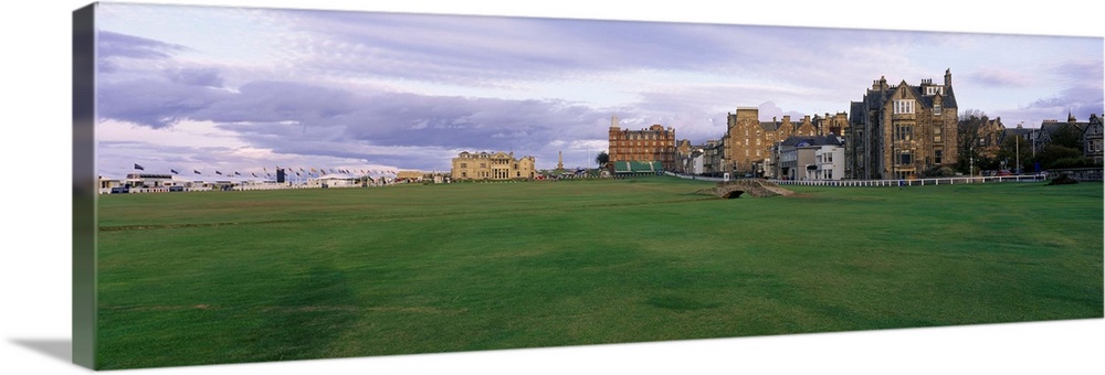 Panoramic picture taken of buildings that are a part of a famous golf club in Scotland.