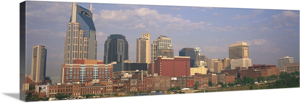 Large horizontal panoramic photograph of the downtown Nashville, Tennesee (TN) skyline with skyscrapers and other buildings.
