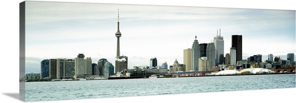This decorative accent is a panoramic photograph of the downtown city skyline taken from across the water.