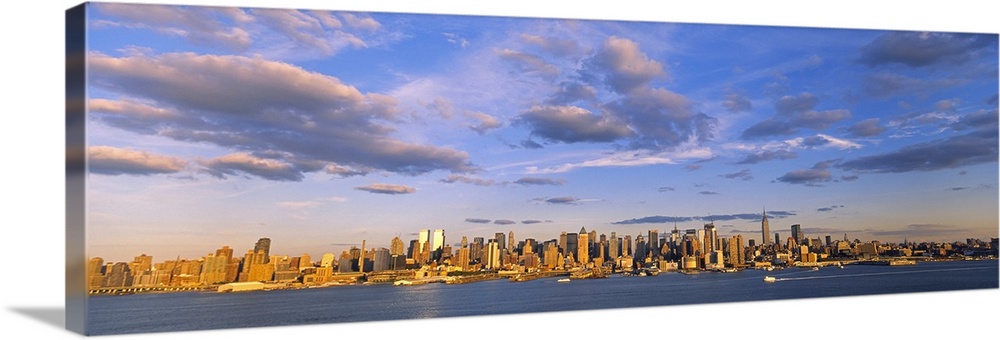 This is a very wide angle photograph including many of the skyscrapers of Manhattan in this panoramic wall art.