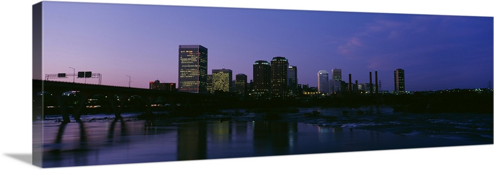 This decorative wall art for the home or office is a panoramic photograph of the city downtown taken from across the James...