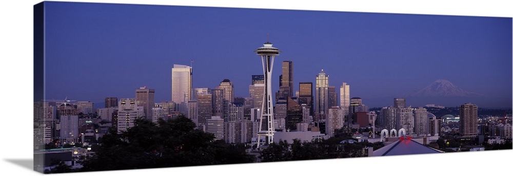 A panoramic view of the Seattle skyline with the space needle focused in the middle.