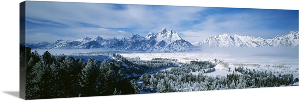 This is a panoramic photograph of the snowscape surrounding these Montana mountain peaks in winter.