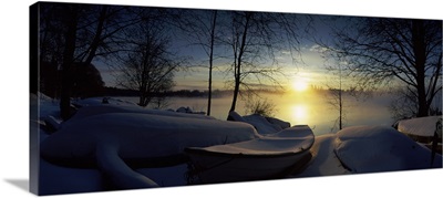 Snow covered boats at the riverside, Vuoksi River, Imatra, South Karelia, Southern Finland, Finland