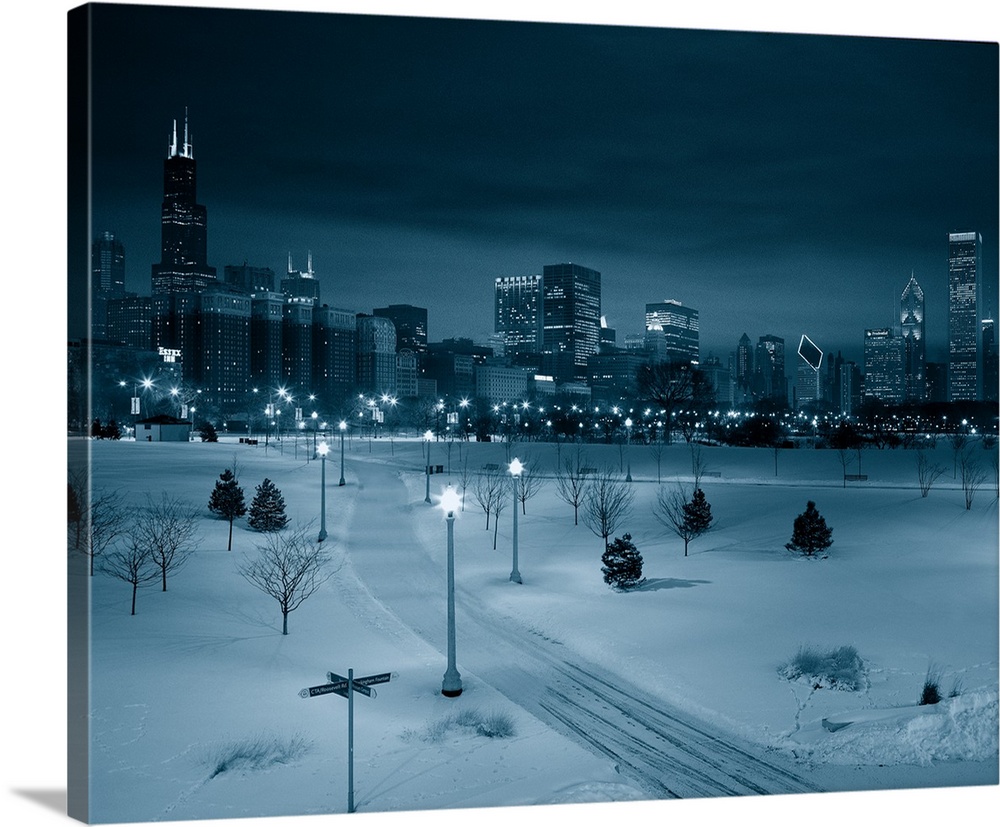 High angle view of snow covered landscape with buildings in the background, Chicago, Illinois, USA