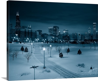 Snow covered landscape with buildings in the background, Chicago, Illinois