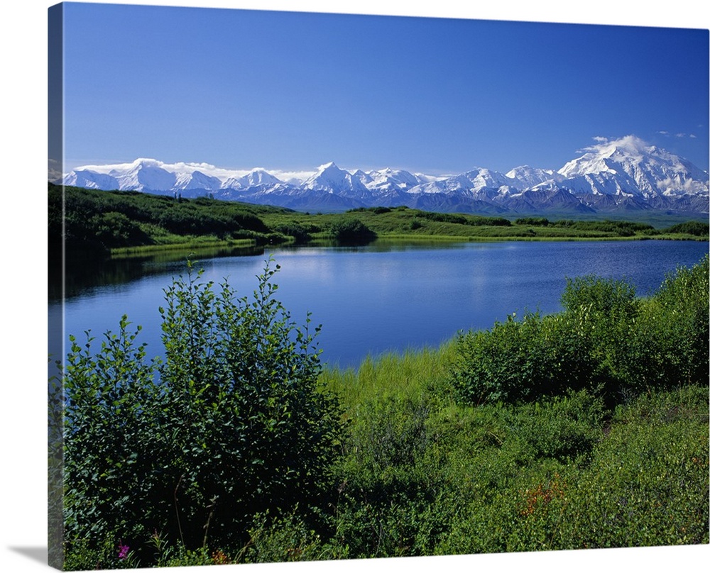 Snow-covered Mount McKinley, mountain lake, blue sky, Denali National Park, Alaska