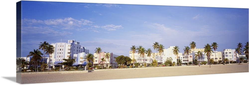Panoramic wall art of hotels lining a beach in Florida.
