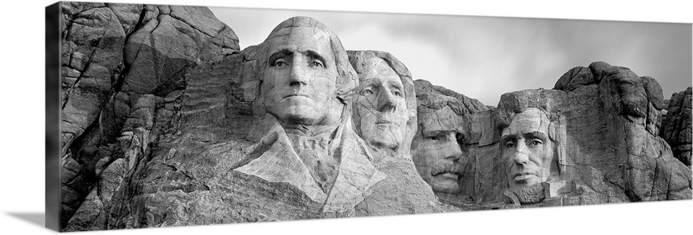 Black and white panorama of Mount Rushmore, a granite sculpture in South Dakota that took 14 years to complete.