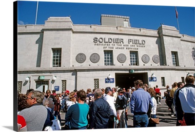 Spectators standing in front of a football stadium, Soldier Field, Chicago, Illinois