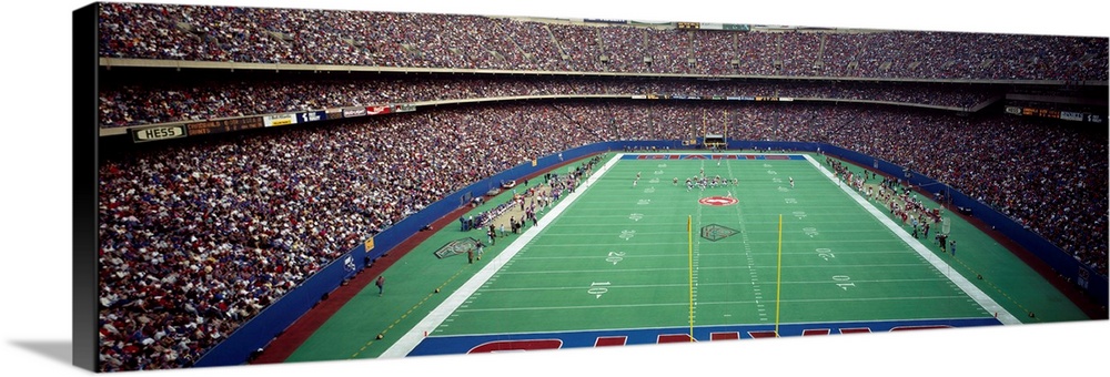 Spectators watching a football match in a stadium, Giants Stadium, East Rutherford, Bergen County, New Jersey, USA.