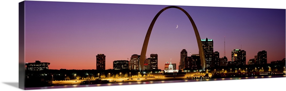 Wide angle view of the St. Louis skyline including the Gateway Arch, at sunset.