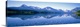 image thumbnail of Mountains line the back of this panoramic photograph that is taken from across a crystal clear lake. The land and mountain...