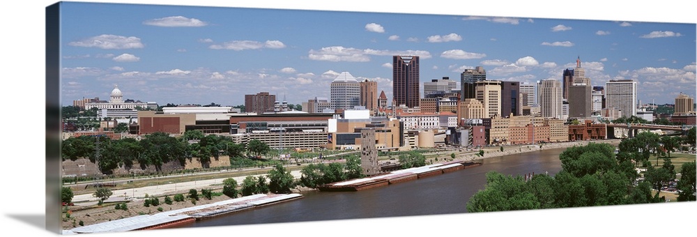Panoramic photo on canvas of a cityscape in Minnesota along a waterfront during the daytime.
