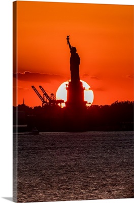 Statue of Liberty sunset. NYC harbor, Manhattan