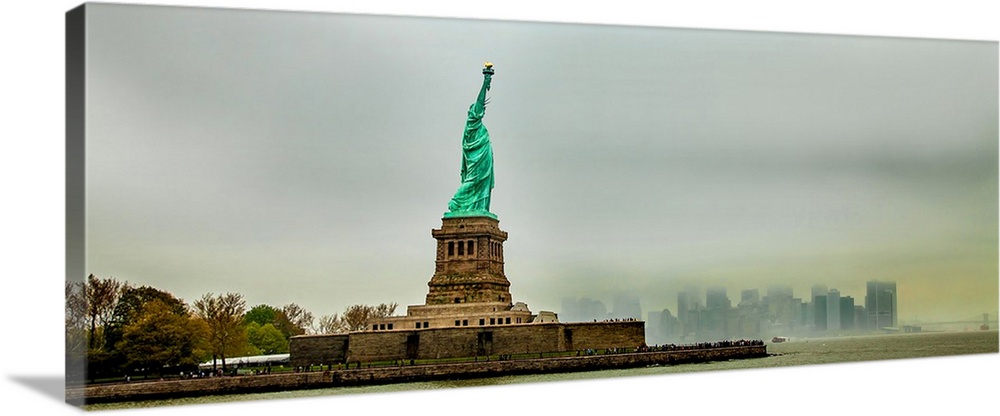 Statue of Liberty with cityscape in the background, Liberty Island, New York City, New York State, USA.