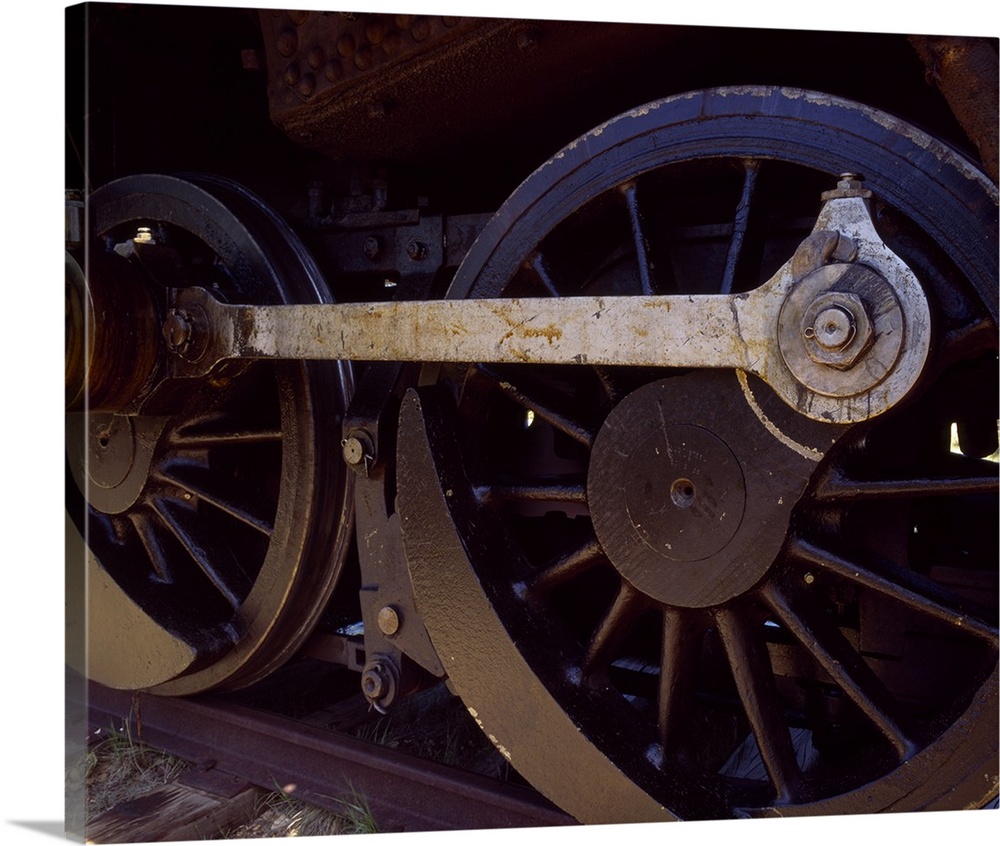 Up-close photograph of wheels on a train.