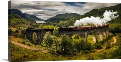 Steam Train Moving On Old Bridge, Scotland