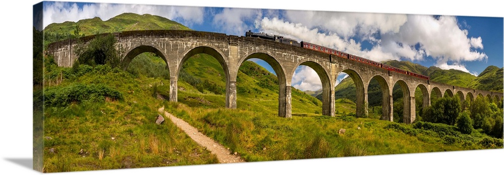 Steam train on old bridge, scottish highlands, scotland.