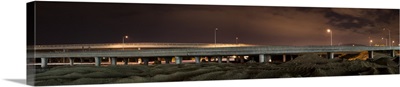Street lights lit up at night on an overpass, California