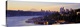 image thumbnail of Dawn on the shoreline of a harbor in a Northwestern city, with the faint image Mount Rainier in the distance.