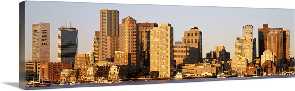 Huge, panoramic photograph of the Boston skyline in the morning sun.