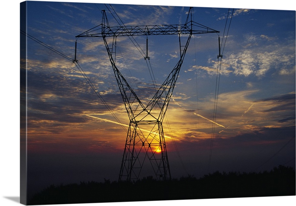 Sunset behind high tension power lines.