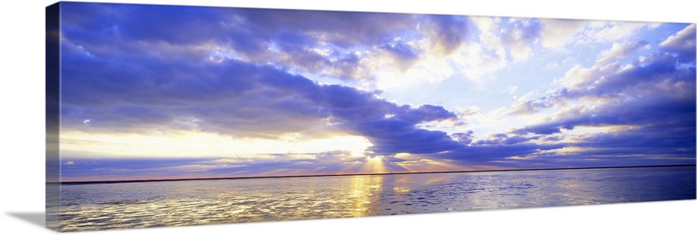 Panoramic photo print of a sunset over an ocean.